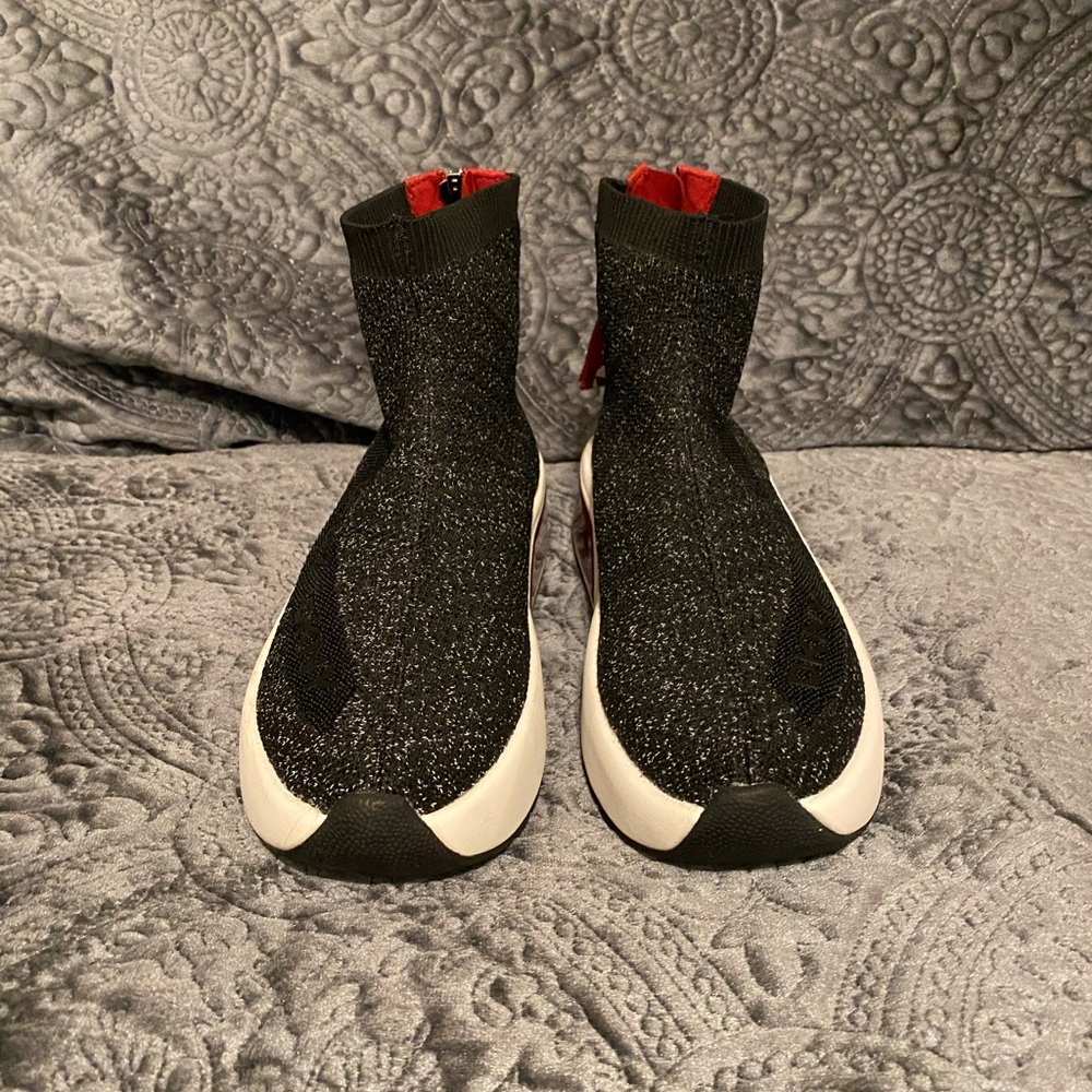 DKNY high top zip up black shoe.